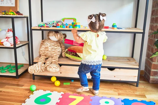 Beautiful Toddler Standing Taking Toys Shelving Kindergarten — Stock Photo, Image