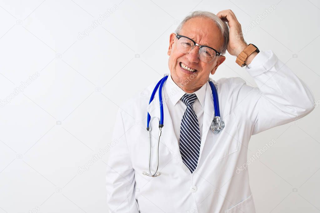 Senior grey-haired doctor man wearing stethoscope standing over isolated white background confuse and wonder about question. Uncertain with doubt, thinking with hand on head. Pensive concept.