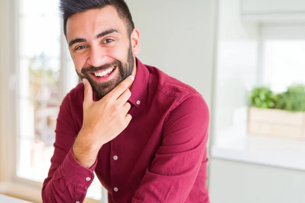 Handsome man smiling cheerful with a big smile on face showing teeth, positive and happy expression