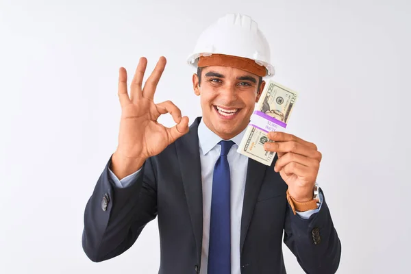 Joven Arquitecto Guapo Con Casco Sosteniendo Dólares Sobre Fondo Blanco —  Fotos de Stock