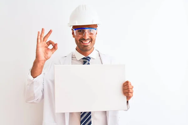 Young Chemist Man Wearing Security Helmet Holding Signboard Isolated Background — Stock Photo, Image