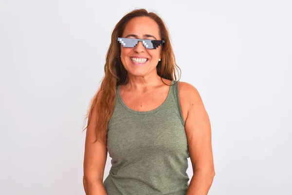 Middle age mature woman wearing thug life sunglasses over isolated background with a happy and cool smile on face. Lucky person.