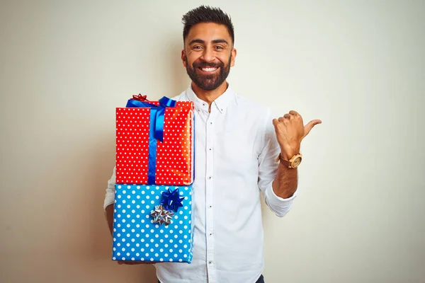 Young Arab Indian Hispanic Man Holding Birthday Gifts Standing Isolated — Stockfoto