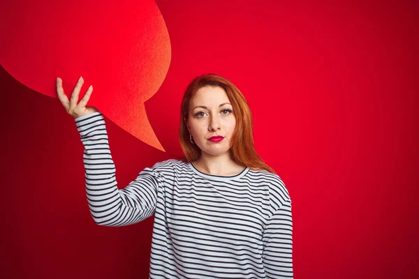 Young Beautiful Redhead Woman Holding Speech Bubble Red Isolated Background — 图库照片