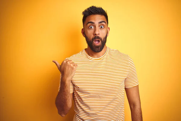 Young Indian Man Wearing Shirt Standing Isolated Yellow Background Surprised — ストック写真