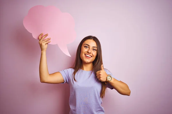 Young Beautiful Woman Holding Cloud Speech Bubble Isolated Pink Background — Stock fotografie