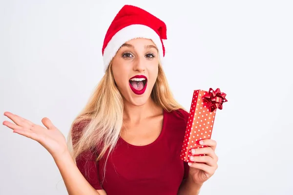 Beautiful Woman Wearing Christmas Santa Hat Holding Gift Isolated White — Stock Photo, Image