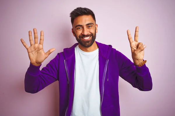 Young Indian Man Wearing Purple Sweatshirt Standing Isolated Pink Background — ストック写真