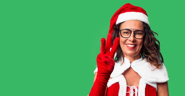 Middle Age Woman Wearing Santa Claus Costume Showing Pointing Fingers — Stockfoto