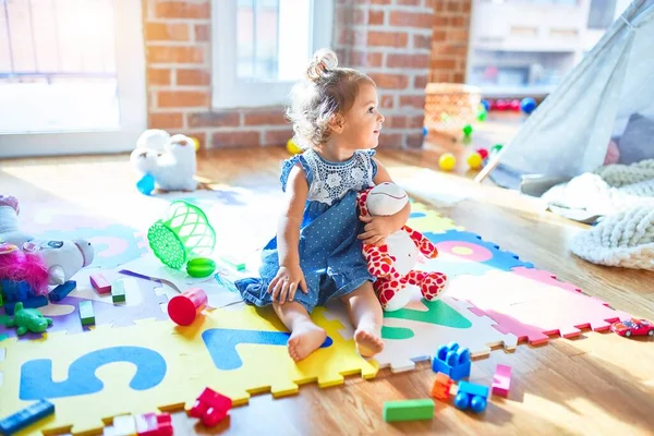 Adorable Toddler Smiling Happy Sitting Floor Playing Giraffe Doll Lots — Stock Photo, Image