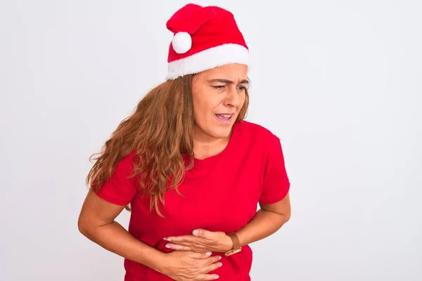 消化不良 痛みを伴う病気が体調不良のため 中年の成熟した女性は胃の上に手で孤立した背景にクリスマスの帽子をかぶって アチェの概念 — ストック写真