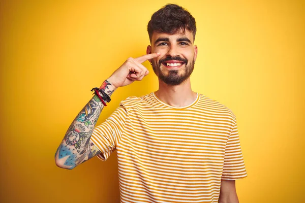 Young Man Tattoo Wearing Striped Shirt Standing Isolated Yellow Background — ストック写真
