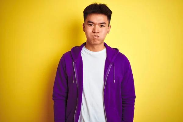 Young Asian Chinese Man Wearing Purple Sweatshirt Standing Isolated Yellow — 스톡 사진