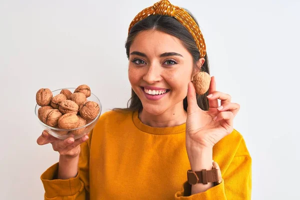 Young Beautiful Woman Holding Bowl Walnuts Standing Isolated White Background — ストック写真