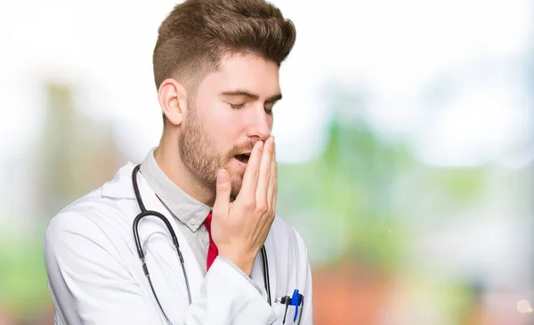 Young Handsome Doctor Man Wearing Medical Coat Bored Yawning Tired — Stock Photo, Image