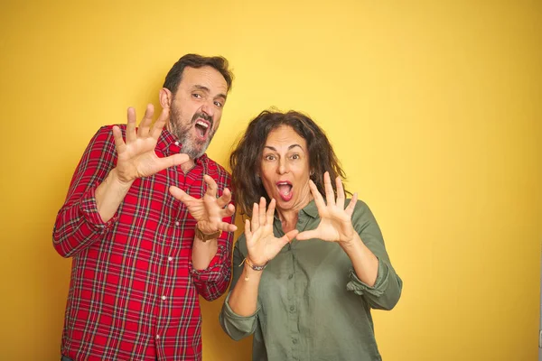 Beautiful Middle Age Couple Isolated Yellow Background Afraid Terrified Fear — Stockfoto