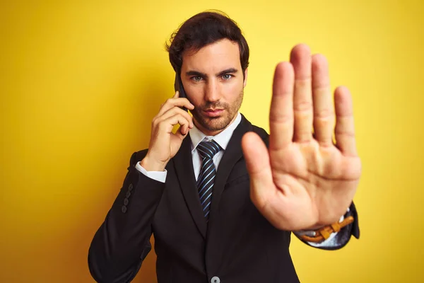 Young Handsome Businessman Talking Smartphone Isolated Yellow Background Open Hand — Stock Photo, Image