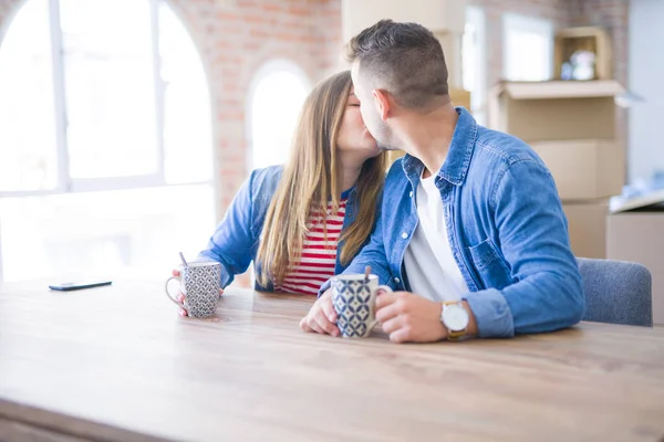 Young couple taking a break drinking a cup of coffee, very happy — Stock Photo, Image