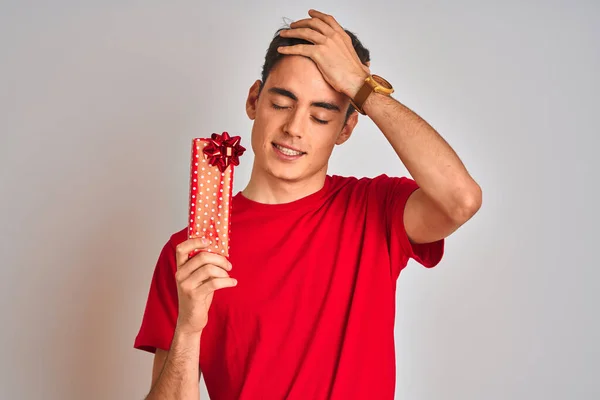 Teenager Boy Holding Birthday Gift Isolated Background Stressed Hand Head — ストック写真
