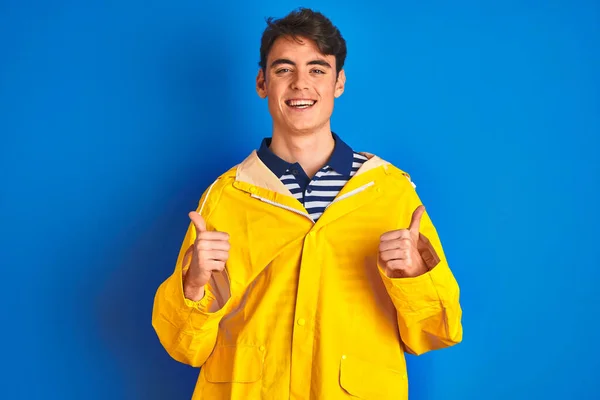 Teenager Fisherman Boy Wearing Yellow Raincoat Isolated Background Success Sign — ストック写真