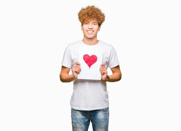 Joven Hombre Guapo Sosteniendo Papel Con Corazón Rojo Con Una — Foto de Stock