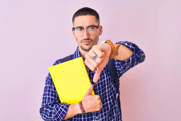 Young Handsome Student Man Holding Book Isolated Background Angry Face — Stock Photo, Image