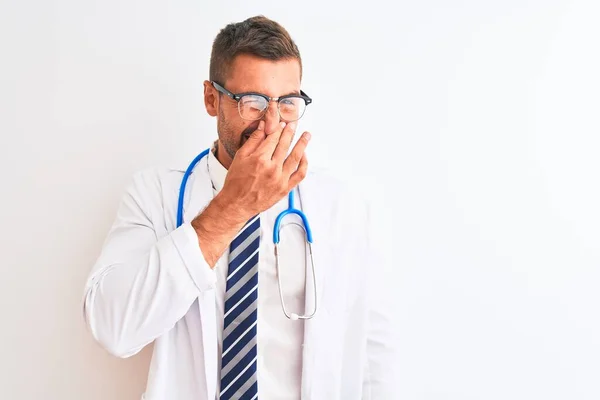 Young Handsome Doctor Man Wearing Stethoscope Isolated Background Smelling Something — Stock Photo, Image