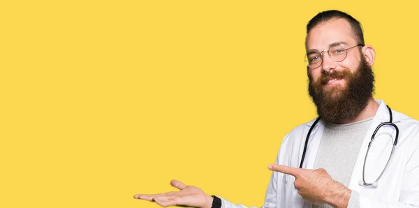 Young Blond Doctor Man Beard Wearing Medical Coat Amazed Smiling — Stock Photo, Image