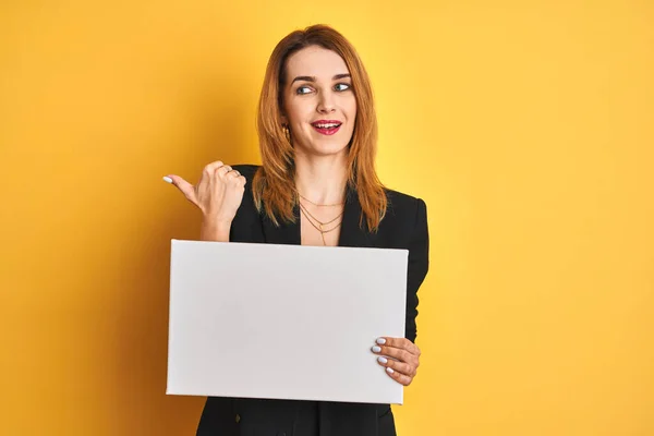 Redhead Business Caucasian Woman Holding Banner Yellow Isolated Background Pointing — Stock Photo, Image