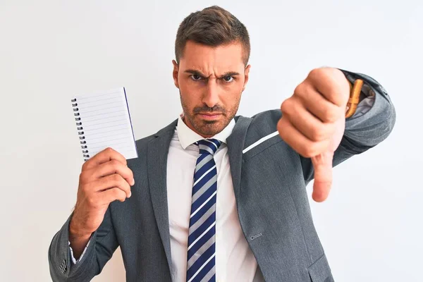 Joven Hombre Negocios Guapo Sosteniendo Cuaderno Blanco Sobre Fondo Aislado —  Fotos de Stock