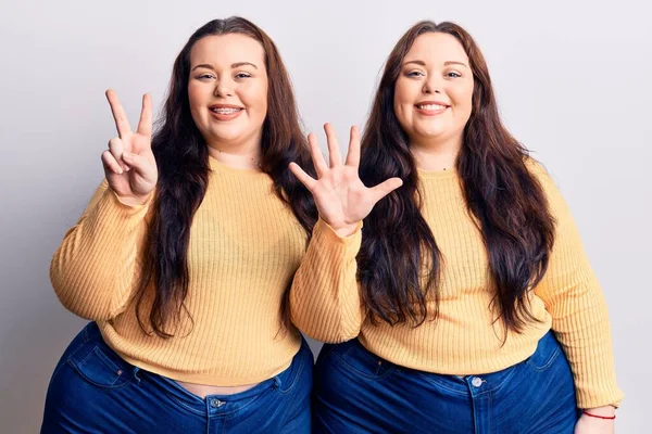 Young Size Twins Wearing Casual Clothes Showing Pointing Fingers Number — Stock Photo, Image