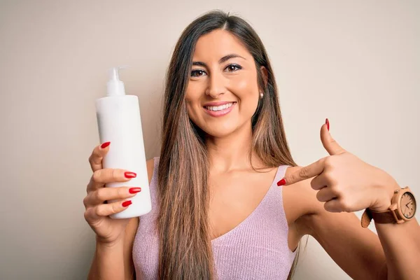 Young Beautiful Brunette Woman Holding Bottle Body Cream Isolated White — Stock Photo, Image