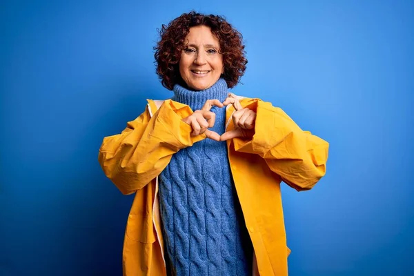 Middle Age Curly Hair Woman Wearing Rain Coat Standing Isolated — Stock Photo, Image