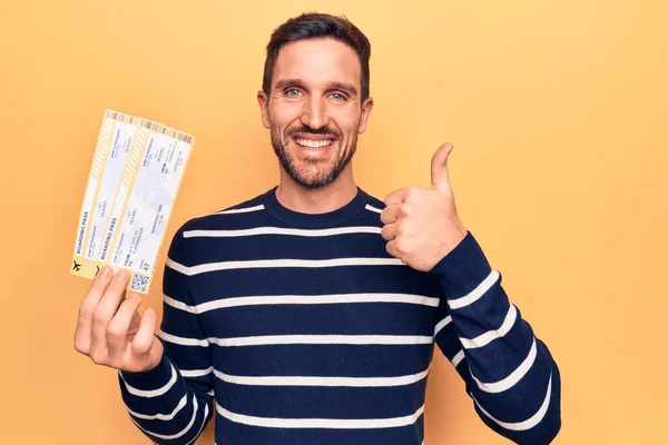 Young Handsome Tourist Man Vacation Holding Airline Boarding Pass Yellow — Stock Photo, Image