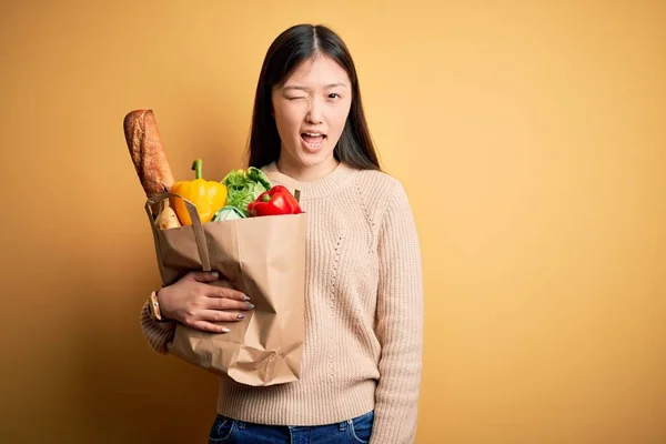 Young Asian Woman Holding Paper Bag Fresh Healthy Groceries Yellow — Stock Photo, Image