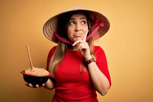 Young Woman Wearing Asian Hat Eating Chinese Noodles Yellow Isolated — Stock Photo, Image