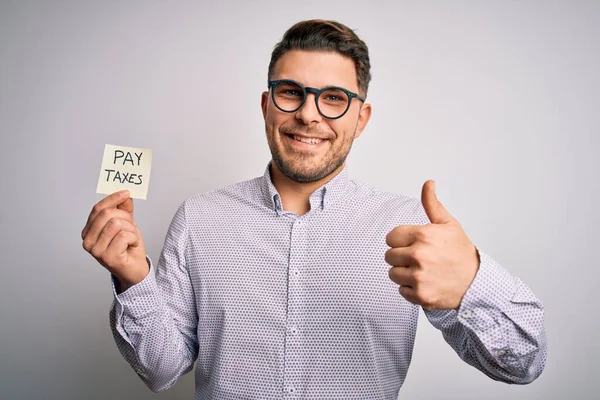 Young Business Man Blue Eyes Holding Pay Taxes Word Paper — Stock Photo, Image