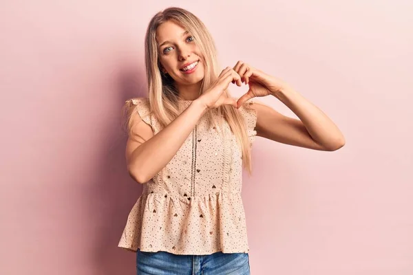 Young Blonde Woman Wearing Casual Clothes Smiling Love Doing Heart — Stock Photo, Image