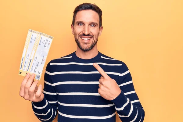 Young Handsome Tourist Man Vacation Holding Airline Boarding Pass Yellow — Stock Photo, Image