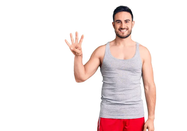 Junger Gutaussehender Mann Badebekleidung Und Ärmellosem Shirt Zeigt Mit Finger — Stockfoto