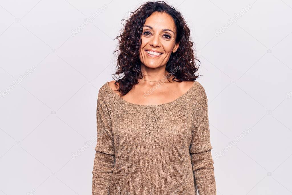 Middle age beautiful woman wearing casual sweater with a happy and cool smile on face. lucky person. 