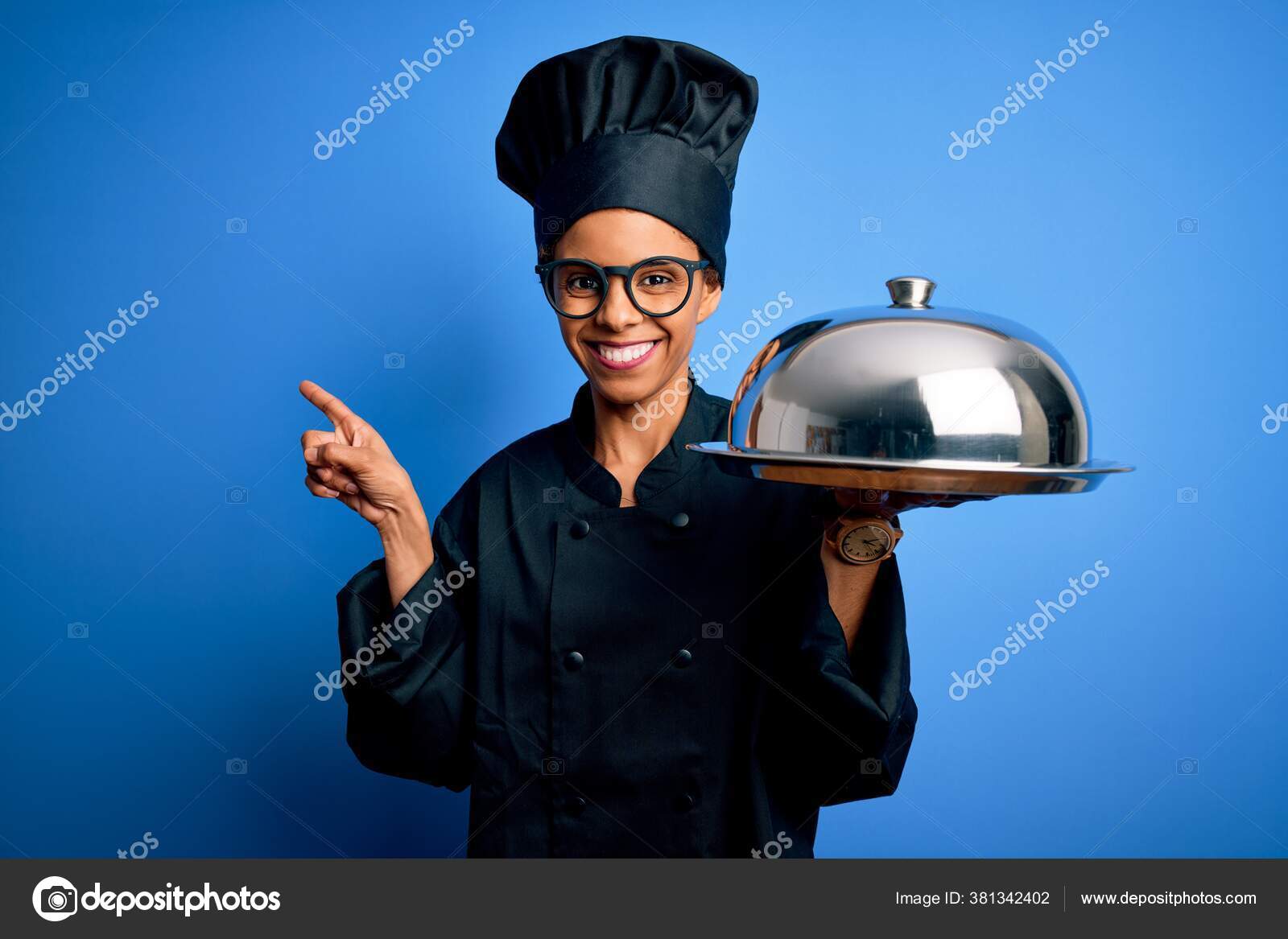 Young African American Cooker Woman Wearing Uniform Holding Waiter Tray  Stock Photo by ©Krakenimages.com 381342402