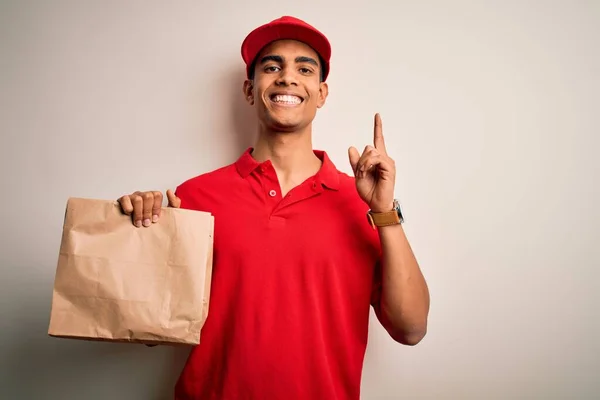 Young Handsome African American Delivery Man Holding Paper Bag Takeaway — Stock Photo, Image