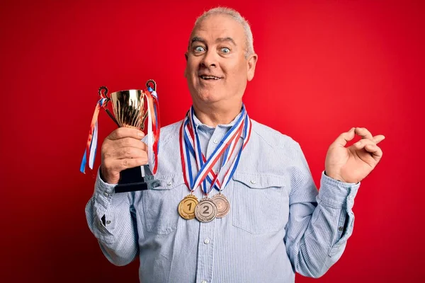 Middle Age Hoary Successful Man Wearing Medals Holding Trophy Isolated — Stock Photo, Image