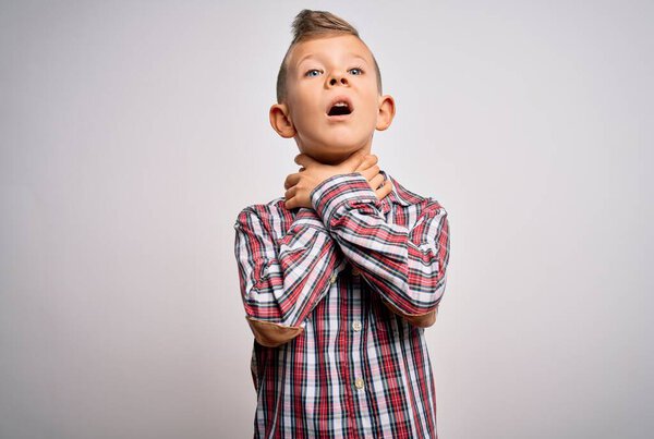 Young little caucasian kid with blue eyes wearing elegant shirt standing over isolated background shouting suffocate because painful strangle. Health problem. Asphyxiate and suicide concept.