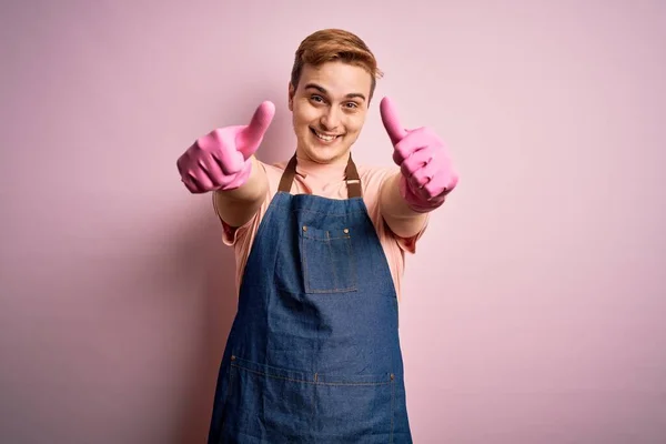 Young Handsome Redhead Cleaner Man Doing Housework Wearing Apron Gloves — Stock Photo, Image