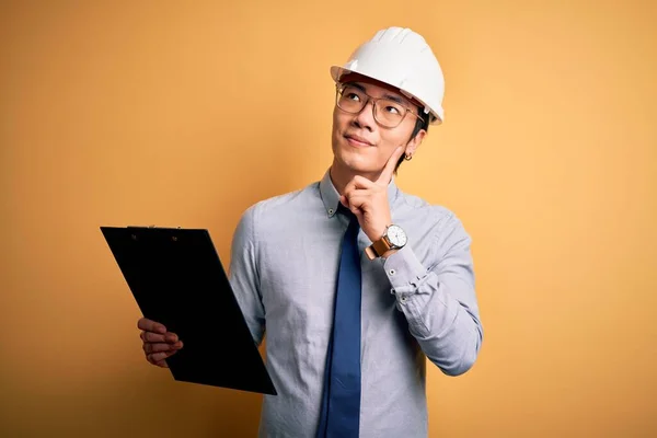 Young Handsome Chinese Engineer Man Wearing Safety Helmet Holding Clipboard — Stock Photo, Image