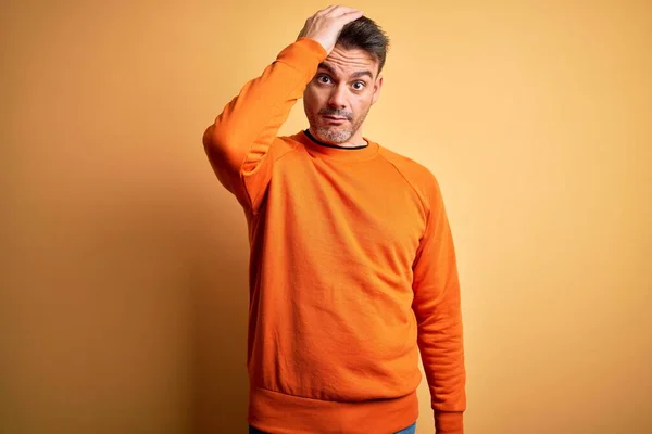 Young Handsome Man Wearing Orange Casual Sweater Standing Isolated Yellow — Stock Photo, Image