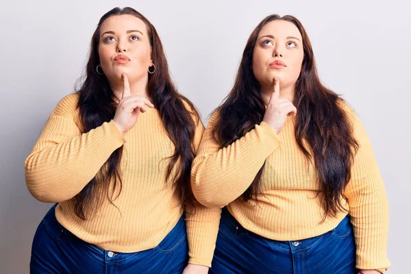 Young Size Twins Wearing Casual Clothes Thinking Concentrated Doubt Finger — Stock Photo, Image