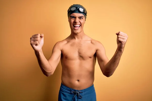 Young Handsome Man Shirtless Wearing Swimsuit Swim Cap Isolated Yellow — Stock Photo, Image